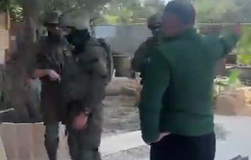 Thumbnail preview image for the video titled: Soldiers filmed activist Issa Amro renovating his home, angering nearby settlers