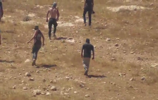 Thumbnail preview image for the video titled: In Sh'ib al-Butum, dozens of settlers pelted residents' homes with stones, broke into the houses, destroyed property, and attacked an elderly woman with clubs