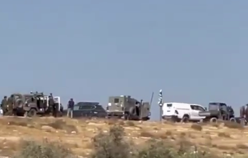 Thumbnail preview image for the video titled: Armed Israeli extremist settlers, backed by soldiers and police, raiding homes in al-Tuwani