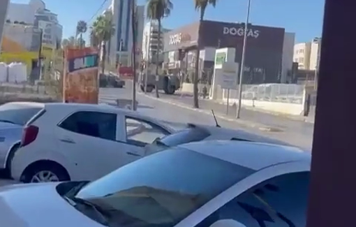 Thumbnail preview image for the video titled: Israeli soldiers forced resident of Al-Bireh to remove national slogans sprayed on the walls