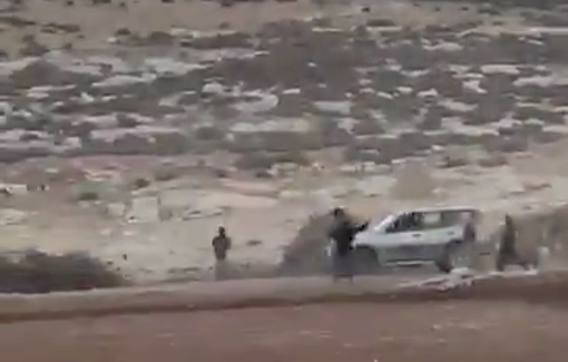 Thumbnail preview image for the video titled: Settlers violently assaulting activist and resident’s vehicle in Al-Sidra, Mukhmas