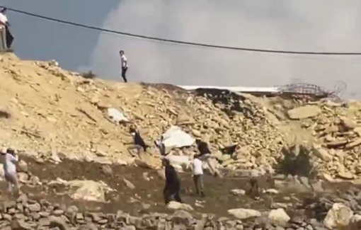 Thumbnail preview image for the video titled: Israeli settlers and soldier harassing local Palestinian residents in Khallet Al-Natsh