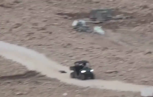 Thumbnail preview image for the video titled: A teenage settler tied a dead goat to an ATV and dragged it on the ground in front of Palestinians