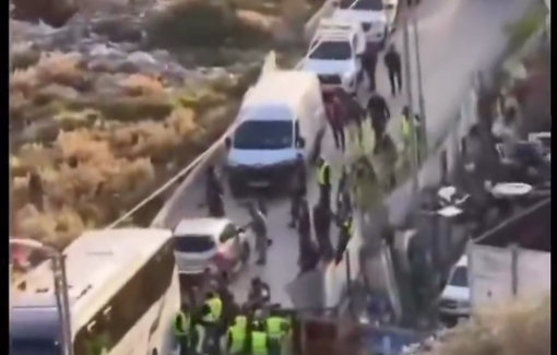 Thumbnail preview image for the video titled: Israeli forces and settlers assaulting a Palestinian during the demolition of a residential building in the town of Silwan