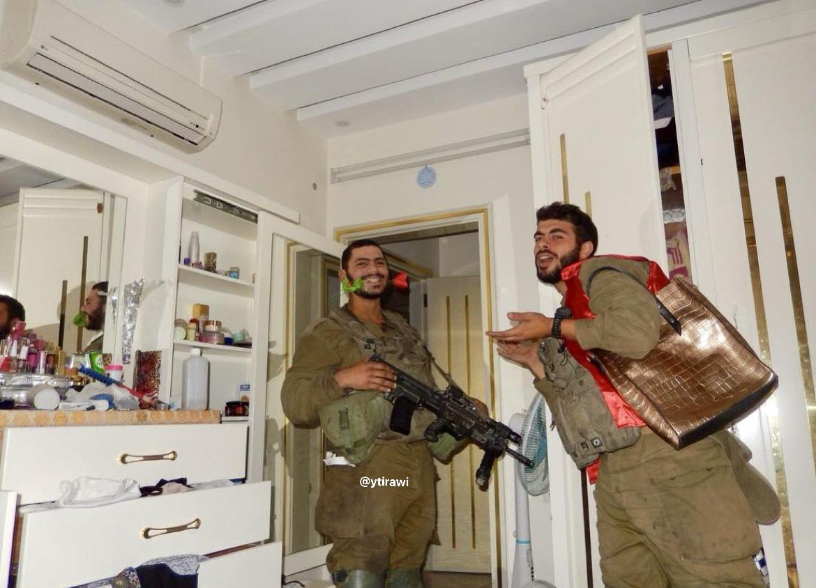 Thumbnail preview image for the video titled: An Israeli soldier showing himself and another soldier leafing through a Palestinian woman’s makeup