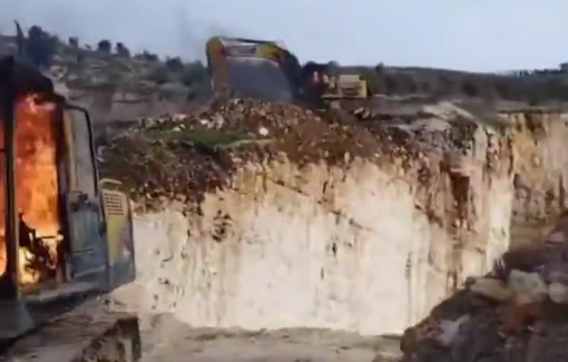 Thumbnail preview image for the video titled: Israeli settlers burn down several bulldozers, trucks, and equipment in the village of Urif