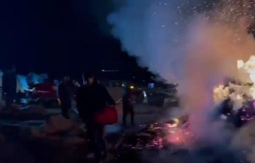 Thumbnail preview image for the video titled: At least forty settlers attacking people, torching property, and blocking ambulances in Al-Halawa