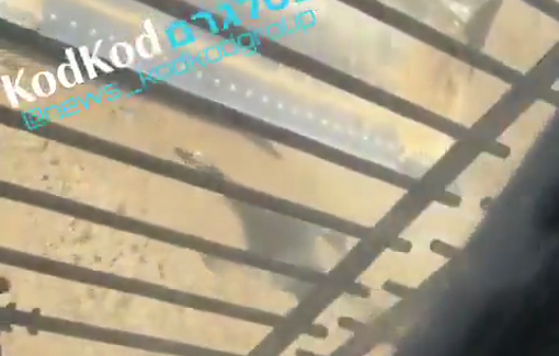 Thumbnail preview image for the video titled: An Israeli military vehicle deliberately running over the body of a Palestinian civilian killed while fleeing in Gaza