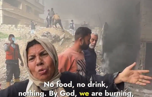 Thumbnail preview image for the video titled: A woman breaks down in tears after a massive fire engulfed her home inside the same building that houses warehouses belonging to the Qatari Committee in Gaza City