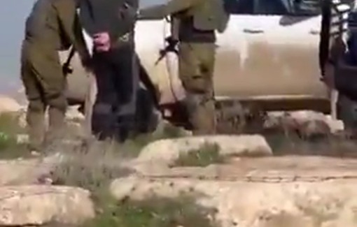 Thumbnail preview image for the video titled: Israeli soldiers arresting a Palestinian man during a raid on Susiya village south of Hebron