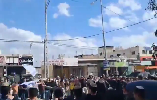 Thumbnail preview image for the video titled: In memory of two settlers killed two years ago, settlers blocked the village of Huwara and sang patriotic chants