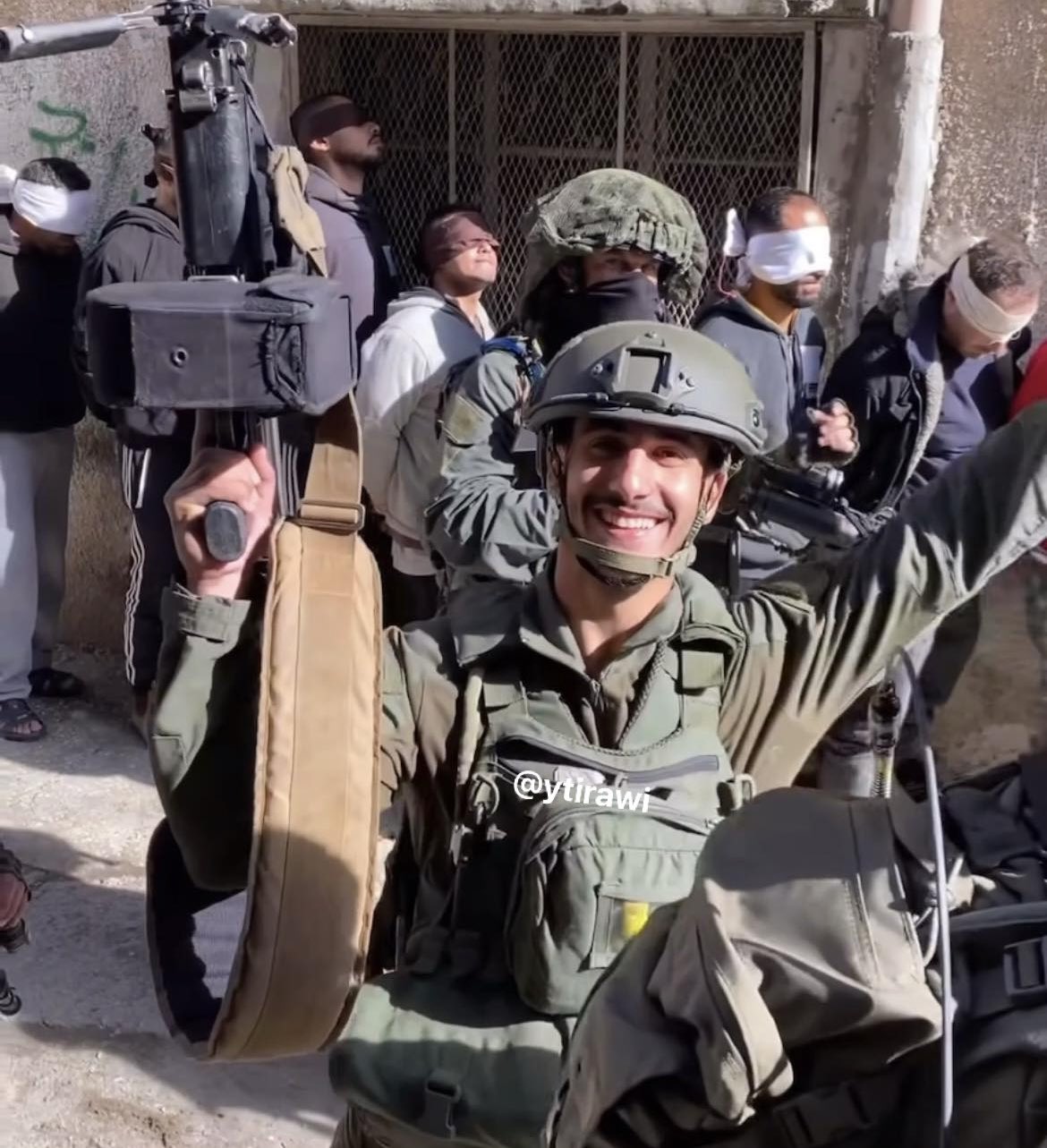 Thumbnail preview image for the video titled: Israeli soldier from the Kfir Brigade displays tens of Palestinians kidnapped in the city of Tulkarem