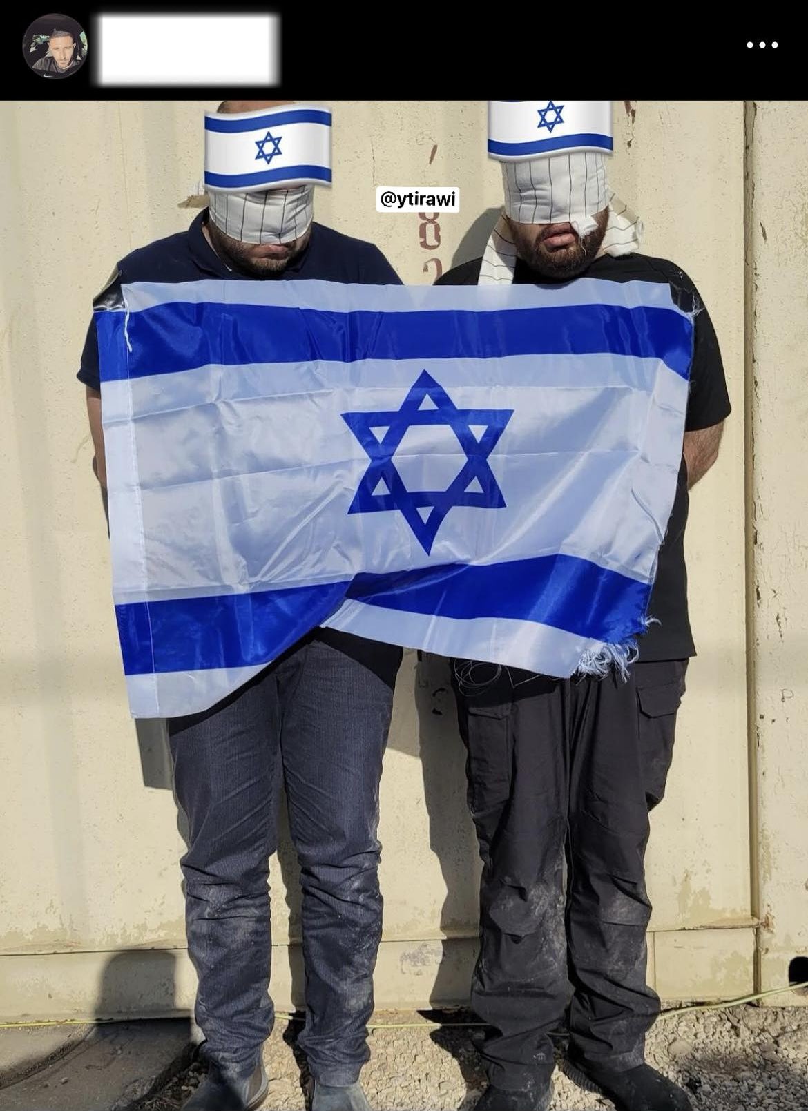 Thumbnail preview image for the video titled: An Israeli military captain from the 9221 battalion of the Ephraim Brigade displaying two Palestinians kidnapped with an Israeli flag