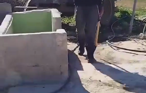 Thumbnail preview image for the video titled: A Jewish settler carrying a club emptied the resident water onto the ground in Khirbet al-Fakheit