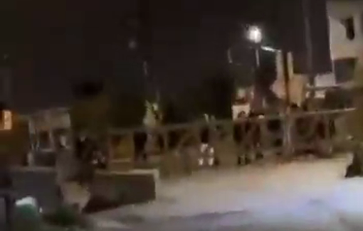 Thumbnail preview image for the video titled: Israeli settlers gathering at the entrance to the village of Hares in the West Bank before attacking its residents