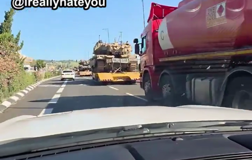 Thumbnail preview image for the video titled: A random Israeli driver uses foul, violent language in an ecstatic rant while passing IDF tanks on their way to the Lebanese border