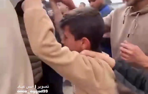 Thumbnail preview image for the video titled: Child carries the body of father, among 5 killed by Israeli night strike on Al-Shati camp