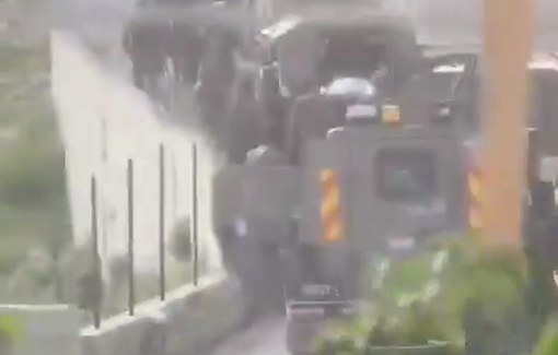 Thumbnail preview image for the video titled: The moment of the Israeli forces holding the body of the executed child Muhammad Murad Rayan in the town of Beit Duqqu