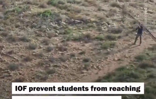 Thumbnail preview image for the video titled: Israeli soldies and settlers continue to prevent Palestinian students from reaching their school in the village of Umm al-Khair