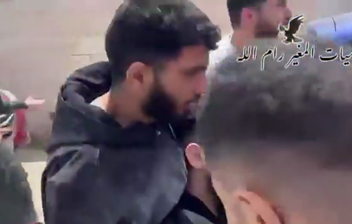 Thumbnail preview image for the video titled: A settler gunman attacking a school in Al-Mughayyir, killing two Palestinians