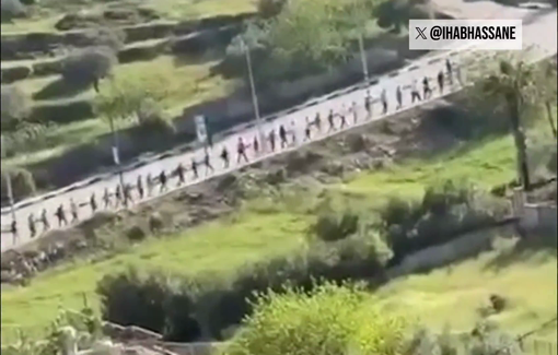 Thumbnail preview image for the video titled: Israeli soldier parading Palestinian men from the village od Deir Dibwan after settler carried out a pogrom and killed a resident