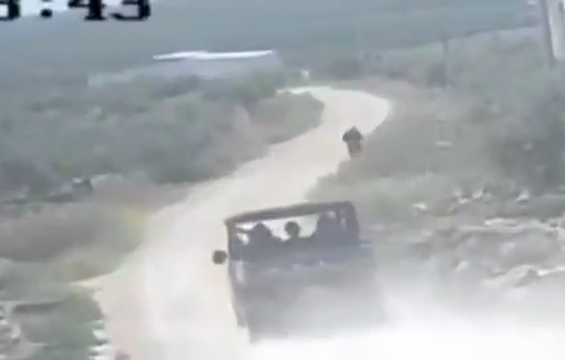 Thumbnail preview image for the video titled: Israeli settlers try to run over a Palestinian youth in the vicinity of Aqrabah town