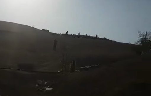 Thumbnail preview image for the video titled: Israeli settlers intimidate and chase local sheep herders near the Bedouin community of Khan Al-Ahmar