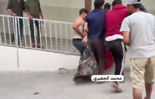 Thumbnail preview image for the video titled: Men take the body of elderly killed by Israeli sniper to hospital