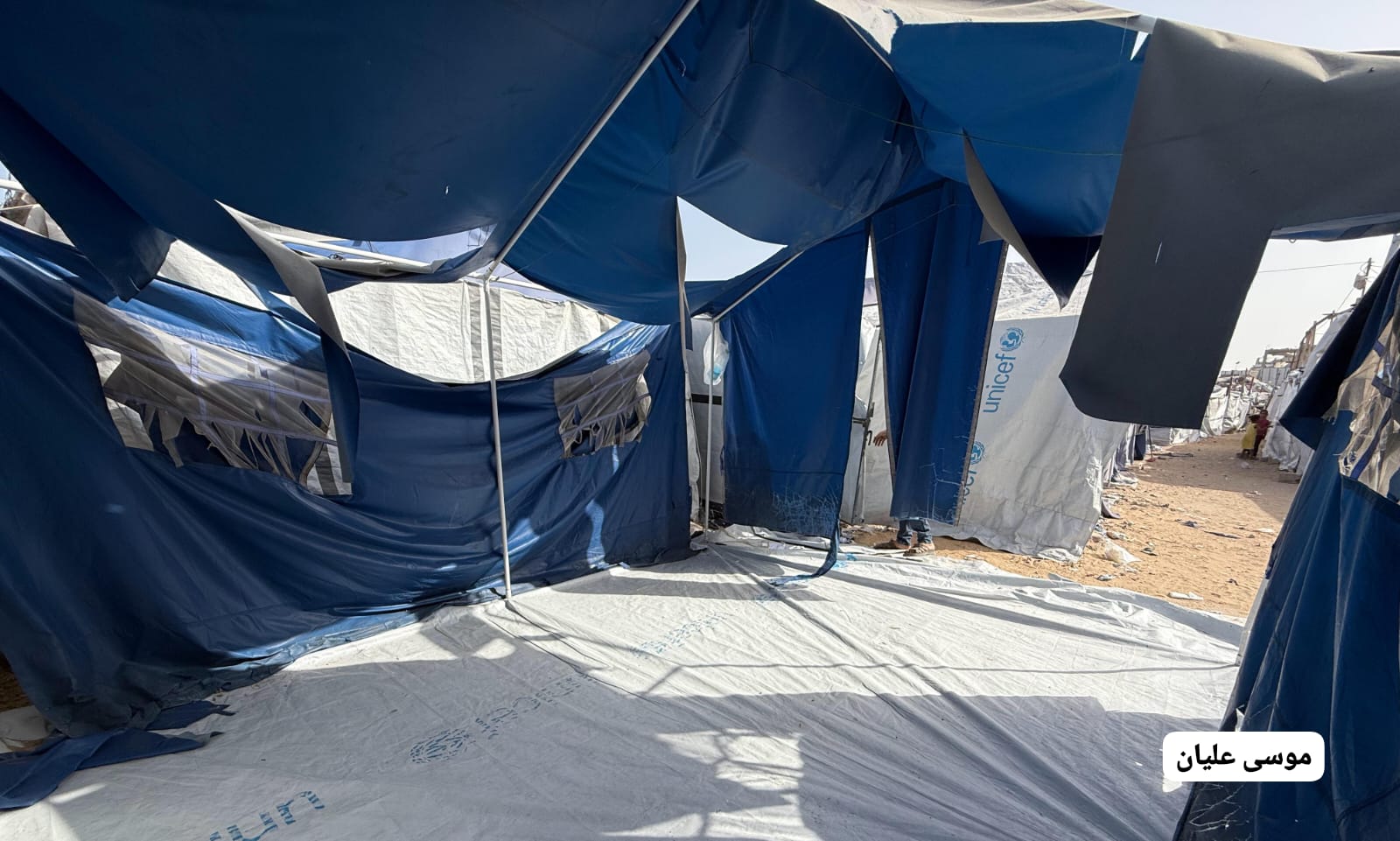 Thumbnail preview image for the video titled: Tents damaged by violent Israeli bombing of Al-Faluja area, North Gaza