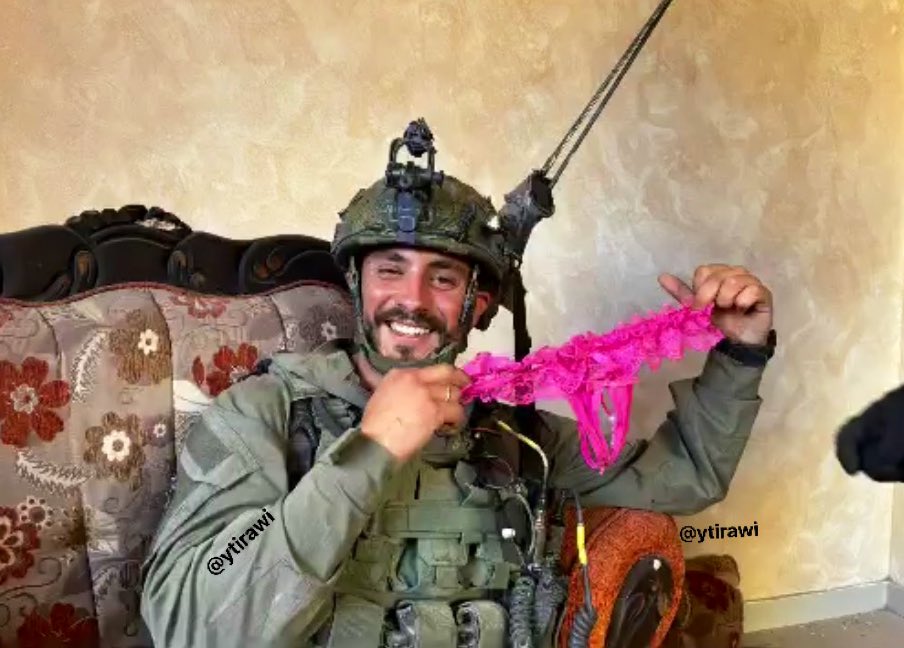 Thumbnail preview image for the video titled: n Israeli officer from the Carmeli Brigade displaying underwear of Palestinian women in Zeitoun neigborhood
