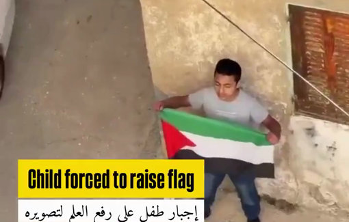 Thumbnail preview image for the video titled: Israeli soldiers forced a Palestinian child to hold a flag, photographed him, and used it to justify his arrest