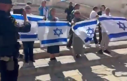 Thumbnail preview image for the video titled: Settlers brandish Israeli flags and chant the Israeli anthem at Al-Aqsa mosque