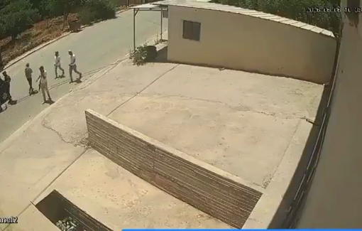 Thumbnail preview image for the video titled: Footage from Huwara shows an Israeli soldier and a group of settlers beating two Palestinian men during a pogrom