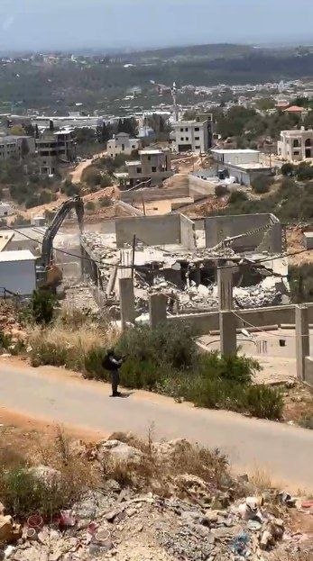 Thumbnail preview image for the video titled: Israeli forces demolishing several homes in the Palestinian town of Barta’a, which is split down the middle by the 1949 Green Line