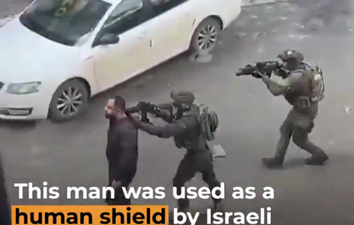 Thumbnail preview image for the video titled: Palestinian shop owner Baha Abu Ras being used as a human shield by several Israeli soldiers in Dura