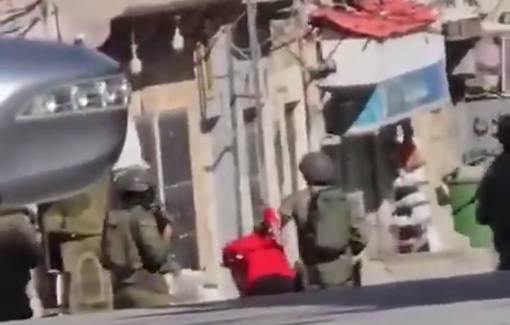 Thumbnail preview image for the video titled: Israeli soldiers arrested a Palestinian from the Al-Fawwar refugee camp usig hime as human shield in the middle of the streets