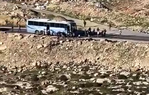 Thumbnail preview image for the video titled: Buses of settlers, backed by soldiers, stormed the Palestinian area of Tarousa to celebrate Hanukkah