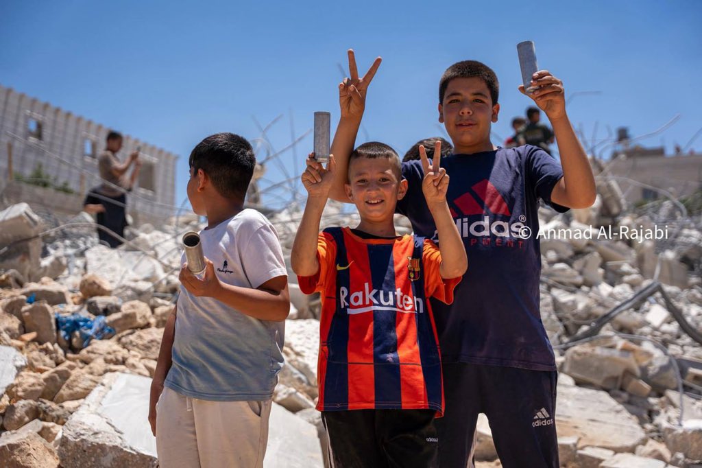 Thumbnail preview image for the video titled: Children on the ruins of their home after Israeli forces tore it down in Khirbet Qalqas