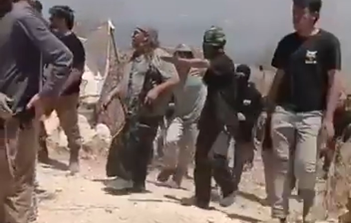 Thumbnail preview image for the video titled: Armed Israeli settlers, backed by soldiers, opened fire on Palestinians, injuring two in the Beit Furik plain