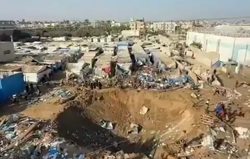 Thumbnail preview image for the video titled: Israel leaves large crater where once stood a hospital's warehouse