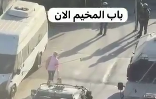 Thumbnail preview image for the video titled: Israeli forces prevented a young Palestinian woman from entering the Qalandiya camp
