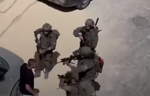 Thumbnail preview image for the video titled: Heavily armed Israeli soldiers violently attacked a defenseless Palestinian youth during their military offensive in Qalandia RC