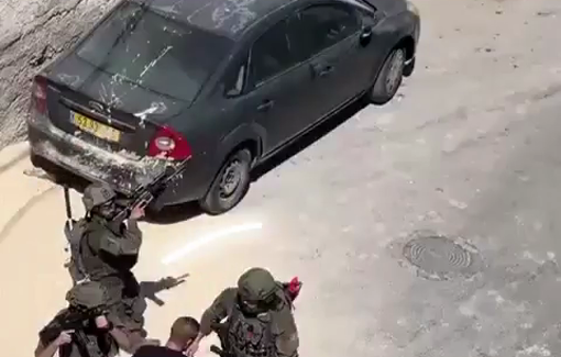 Thumbnail preview image for the video titled: Qalandia RC: How many soldiers does it take to attack an unarmed Palestinian youth who is trying to get to his car?