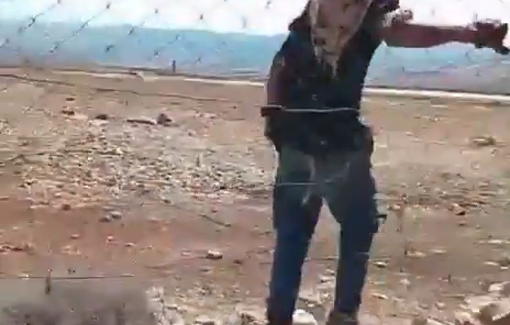 Thumbnail preview image for the video titled: Two settlers are abusing a fence in an attempt to break into a private home in Dar Faza'a, near Taybeh