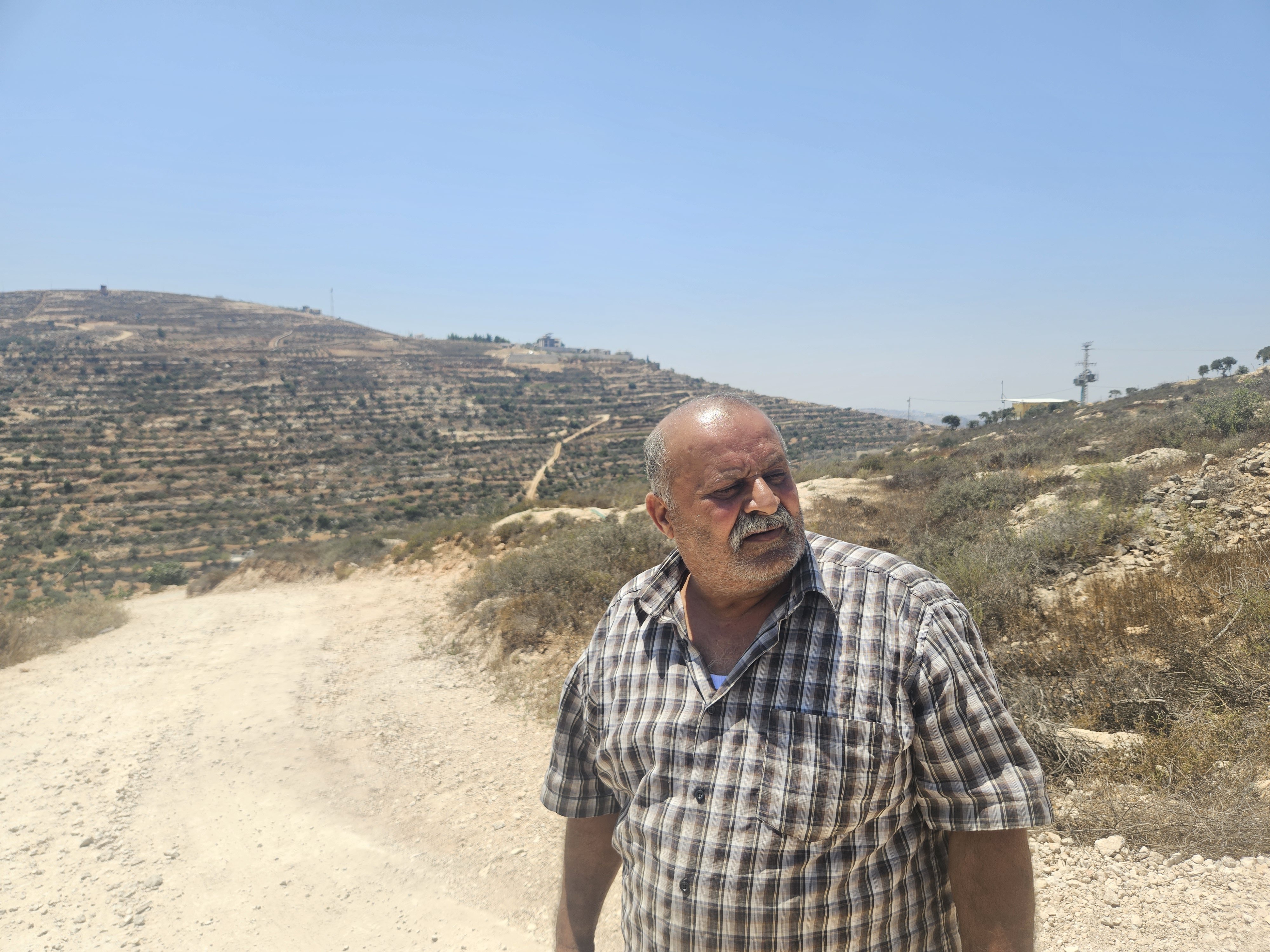 Thumbnail preview image for the video titled: Abdel Karim Hassan, Yosef's father, unable to return to his home in Qusra, now lives in his car, watching the house every night