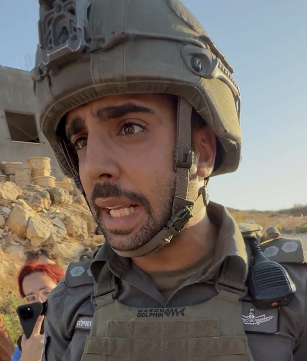 Thumbnail preview image for the video titled: Border Police officer helping the settlers in the siege of the Palestinian home in Qusra