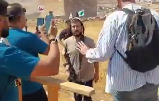 Thumbnail preview image for the video titled: Armed settlers assault peaceful activists and journalists in Beit Sahour after they removed Israeli flags and a Star of David from Palestinian property