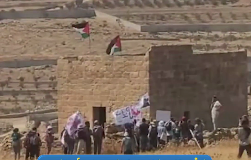 Thumbnail preview image for the video titled: Armed settlers assaulted activists removing a giant Star of David on the roof of a Palestinian property in Beit Sahour
