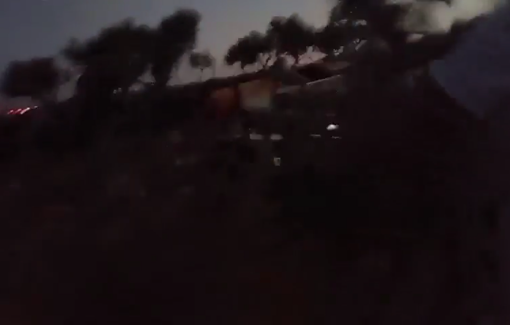 Thumbnail preview image for the video titled: Masked Israeli settlers terrorizing the Bedouin community in the entrance of Taybeh during the night