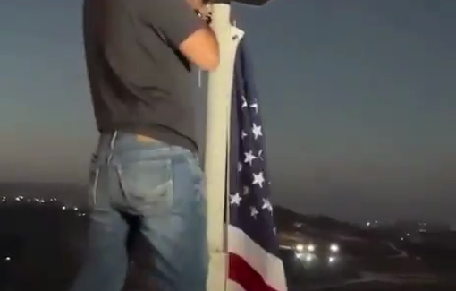 Thumbnail preview image for the video titled: Palestinian-American citizen Loui Abu Ridi raises the American flag above his besiged home in Qusra